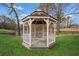 Well-maintained gazebo with decorative railings and flooring, providing a peaceful outdoor retreat at 5422 Hill Sw Rd, Powder Springs, GA 30127