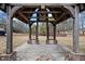 View from inside a wooden gazebo overlooking a pond and trees at 5422 Hill Sw Rd, Powder Springs, GA 30127