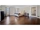 Spacious main bedroom with hardwood floors, natural light, and neutral decor at 5422 Hill Sw Rd, Powder Springs, GA 30127