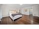 Large main bedroom with hardwood floors, neutral paint, and plenty of natural light at 5422 Hill Sw Rd, Powder Springs, GA 30127