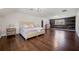 Spacious bedroom with wood accent wall, hardwood floors, and natural light at 5422 Hill Sw Rd, Powder Springs, GA 30127
