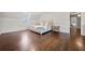 Bright bedroom featuring hardwood floors and a neutral color palette at 5422 Hill Sw Rd, Powder Springs, GA 30127