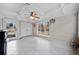 Bright sun room featuring tile floors, coffered ceiling and large windows overlooking a landscaped yard at 5422 Hill Sw Rd, Powder Springs, GA 30127
