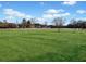 Large green space shows an expansive lot ready for any activity in a rural setting at 5422 Hill Sw Rd, Powder Springs, GA 30127