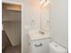 Well-lit bathroom featuring a modern vanity, sleek mirror, and neutral color palette at 5541 Panola Pl, Lithonia, GA 30058