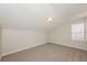 Upstairs bedroom featuring plush carpet, and a bright window at 5541 Panola Pl, Lithonia, GA 30058