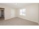 Bedroom features plush carpet, a bright window and fresh neutral paint at 5541 Panola Pl, Lithonia, GA 30058