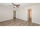 Spacious bedroom features stylish wood-look flooring, ceiling fan and neutral paint at 5541 Panola Pl, Lithonia, GA 30058