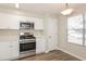 Modern kitchen with stainless steel appliances, stylish cabinets, and plenty of natural light at 5541 Panola Pl, Lithonia, GA 30058