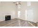 Open living room with vaulted ceiling, fireplace, and lots of natural light at 5541 Panola Pl, Lithonia, GA 30058