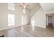 Spacious living room with hardwood floors, high ceiling, and natural light at 5541 Panola Pl, Lithonia, GA 30058
