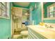Clean bathroom with a shower/tub combo and teal walls at 981 Meadowbrook Nw Ln, Conyers, GA 30012