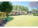 Landscaped lawn and manicured shrubs in front of the house at 981 Meadowbrook Nw Ln, Conyers, GA 30012