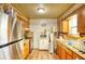 Kitchen with wood cabinets and stainless steel appliances at 981 Meadowbrook Nw Ln, Conyers, GA 30012