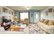 Living room with sofas, armchairs, and a geometric rug at 981 Meadowbrook Nw Ln, Conyers, GA 30012