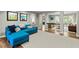 Bright Gathering room with a blue sectional sofa and hardwood floors at 1130 Edgewater Dr, Atlanta, GA 30328