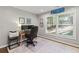 Home office with hardwood floors, built-in desk, and natural light at 1130 Edgewater Dr, Atlanta, GA 30328