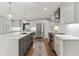 Modern kitchen with large island, stainless steel appliances, and hardwood floors at 1130 Edgewater Dr, Atlanta, GA 30328