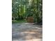 Backyard with shed and wooded area at 1221 Martin Nash Sw Rd, Lilburn, GA 30047