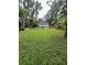 Large grassy backyard with house view at 1221 Martin Nash Sw Rd, Lilburn, GA 30047