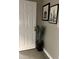 Basement entry with door, plant, and framed art at 1221 Martin Nash Sw Rd, Lilburn, GA 30047