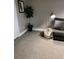 Relaxing basement sitting area with floor lamp and storage basket at 1221 Martin Nash Sw Rd, Lilburn, GA 30047