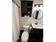 Well-appointed bathroom boasts a new vanity, toilet, and shower at 1221 Martin Nash Sw Rd, Lilburn, GA 30047