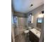 Clean and updated bathroom with a tub, shower, and new vanity at 1221 Martin Nash Sw Rd, Lilburn, GA 30047