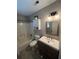 Bathroom features a vanity, toilet, shower and tub at 1221 Martin Nash Sw Rd, Lilburn, GA 30047