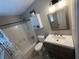 Clean bathroom featuring a tub shower combo and updated vanity at 1221 Martin Nash Sw Rd, Lilburn, GA 30047