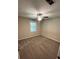 Bright bedroom with grey carpet and ceiling fan at 1221 Martin Nash Sw Rd, Lilburn, GA 30047