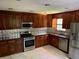 Spacious kitchen with stainless steel appliances and granite countertops at 1221 Martin Nash Sw Rd, Lilburn, GA 30047