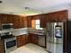 Spacious kitchen with stainless steel appliances and granite countertops at 1221 Martin Nash Sw Rd, Lilburn, GA 30047