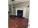 Living room with hardwood floors and fireplace at 1221 Martin Nash Sw Rd, Lilburn, GA 30047