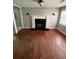 Living room with hardwood floors and fireplace at 1221 Martin Nash Sw Rd, Lilburn, GA 30047