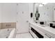 Modern bathroom featuring double vanity and a relaxing bathtub at 1820 Peachtree Nw St # 607, Atlanta, GA 30309