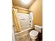 Clean bathroom with shower/tub combo and toilet at 3026 Bridge Walk Dr, Lawrenceville, GA 30044