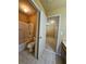 Bathroom features a bathtub and shower combo, and a toilet near a bedroom at 3026 Bridge Walk Dr, Lawrenceville, GA 30044