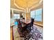 Formal dining room with hardwood floors, chandelier, and large windows at 3026 Bridge Walk Dr, Lawrenceville, GA 30044