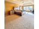 Main bedroom with a king-size bed and access to a private office at 3026 Bridge Walk Dr, Lawrenceville, GA 30044