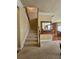 Carpeted staircase with wood railing leading to the upper level at 3026 Bridge Walk Dr, Lawrenceville, GA 30044