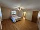 Large bedroom with hardwood floors and en-suite bathroom at 5670 Lanny Dr, Powder Springs, GA 30127