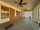 Screened porch features ceiling fans and brick flooring at 5670 Lanny Dr, Powder Springs, GA 30127