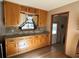 Kitchen with granite countertops and wood cabinets at 5670 Lanny Dr, Powder Springs, GA 30127