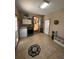 Laundry room with washer, dryer, and access to the backyard at 5670 Lanny Dr, Powder Springs, GA 30127