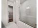 A new bathroom features a marble shower with pebble base and glass doors at 1026 Cagle Creek Overlook, Canton, GA 30115