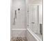 The new bathroom features a shower with a built-in bench and glass door at 1026 Cagle Creek Overlook, Canton, GA 30115