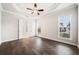 This spacious bedroom has hardwood floors, recessed lighting, and two large windows at 1026 Cagle Creek Overlook, Canton, GA 30115