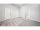 Spacious bedroom with plush gray carpet, neutral walls, and plenty of closet space at 1026 Cagle Creek Overlook, Canton, GA 30115