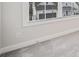 This bedroom features plush gray carpet and a window view of the outside at 1026 Cagle Creek Overlook, Canton, GA 30115